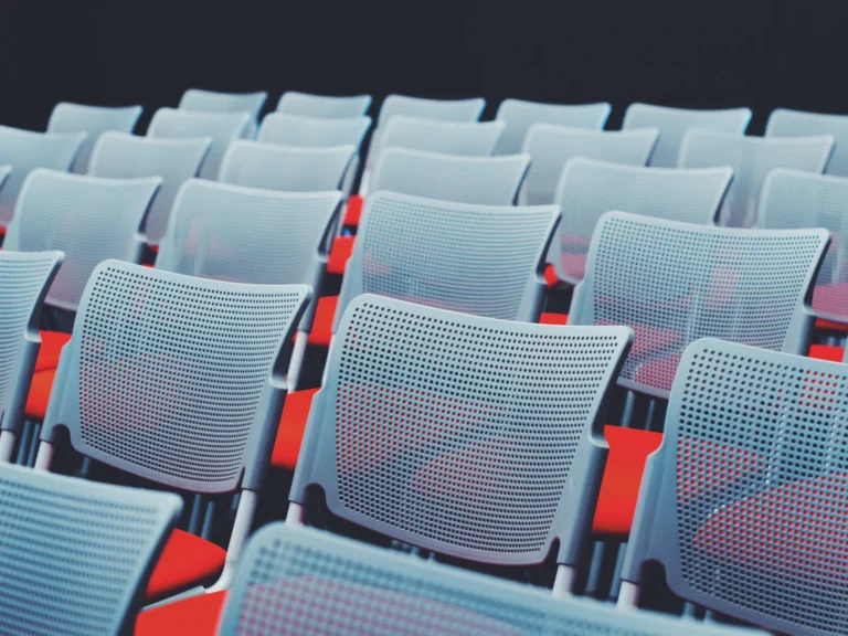 Rows of empty chairs in a conference room